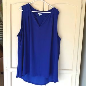Royal blue sleeveless blouse with 3 small pleats on the shoulders.